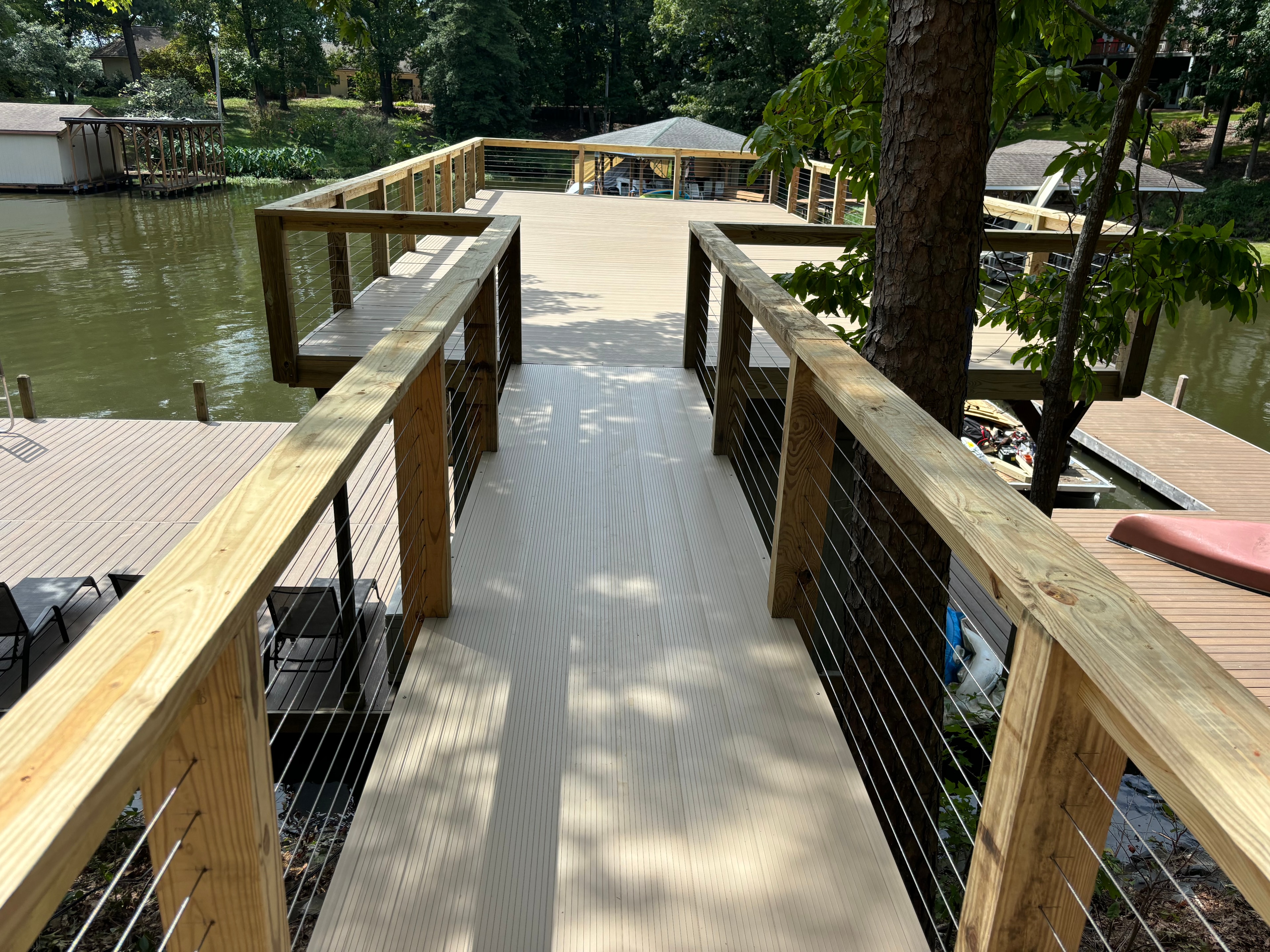 SHT Construction — waterfront dock walkway with cable railings